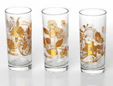 Three glass cups are printed with golden patterns by our range of stainless steel printing mesh.