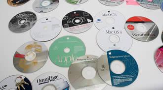 Various optical discs, placed on the table, are printed with different patterns by our range of plastic printing mesh.