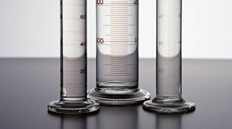 Three measuring glass are printed with scale inks.